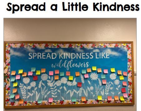 Kindness bulletin board with positive messages to share white flowers and flower border
