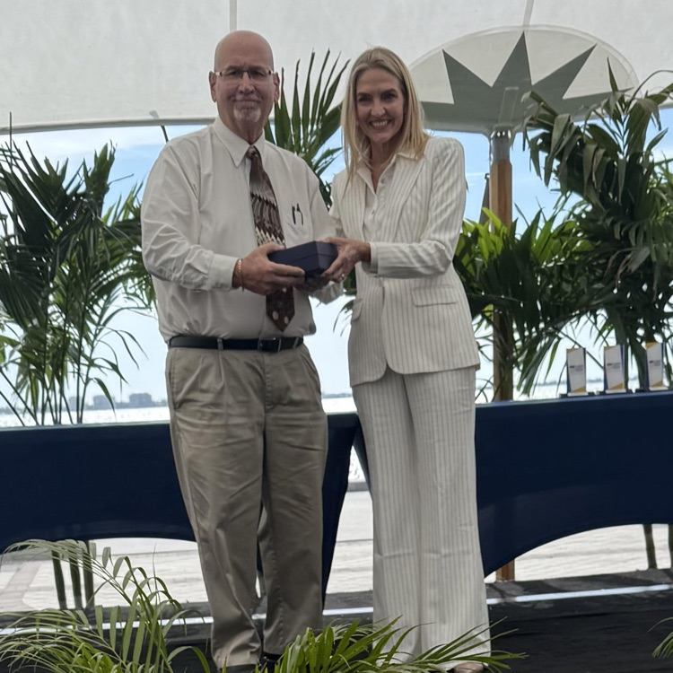 Mr. Barron receiving an award for coach of the year