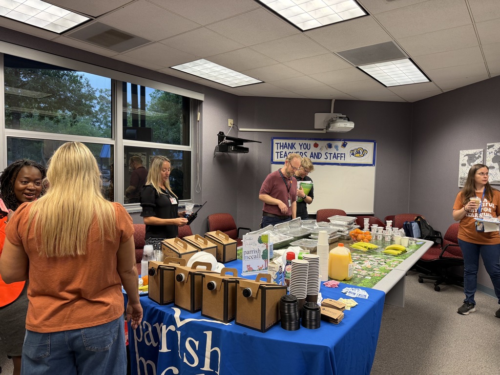 Teachers and staff helping themselves to breakfast provided by PTO and sponsored by Parrish McCall.