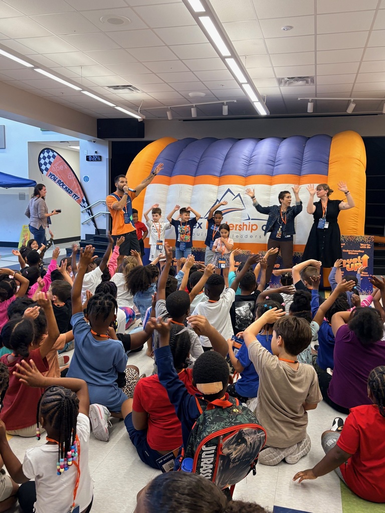 students in the cafeteria doing the YMCA dance