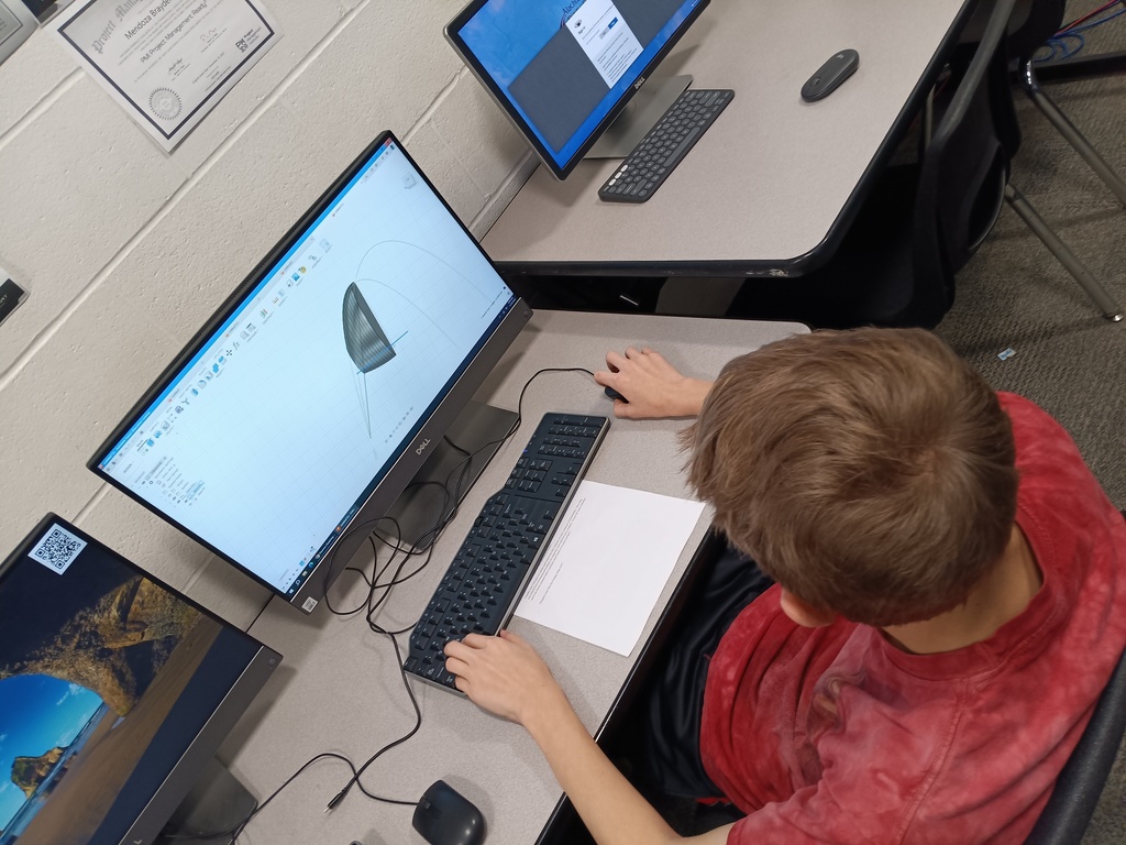 bird's eye view of student and computer