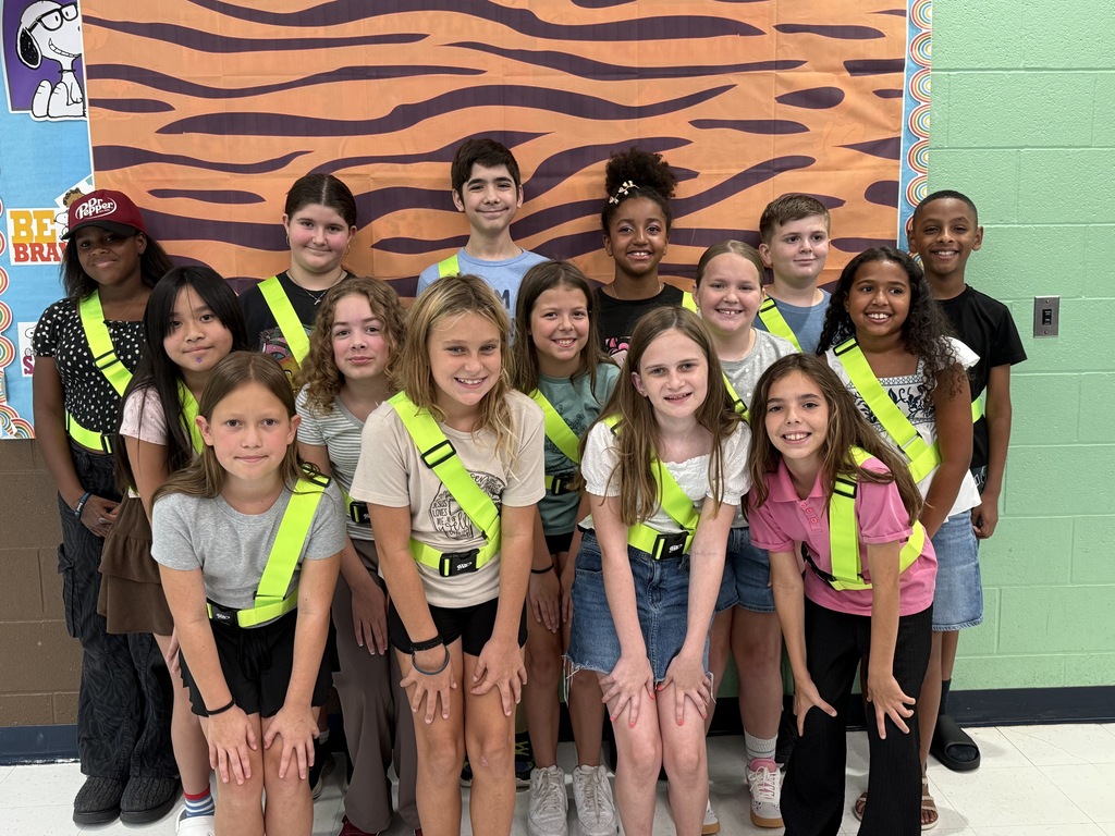 Photo shows 15 fifth grade patrols at their first meeting wearing neon patrol belts.