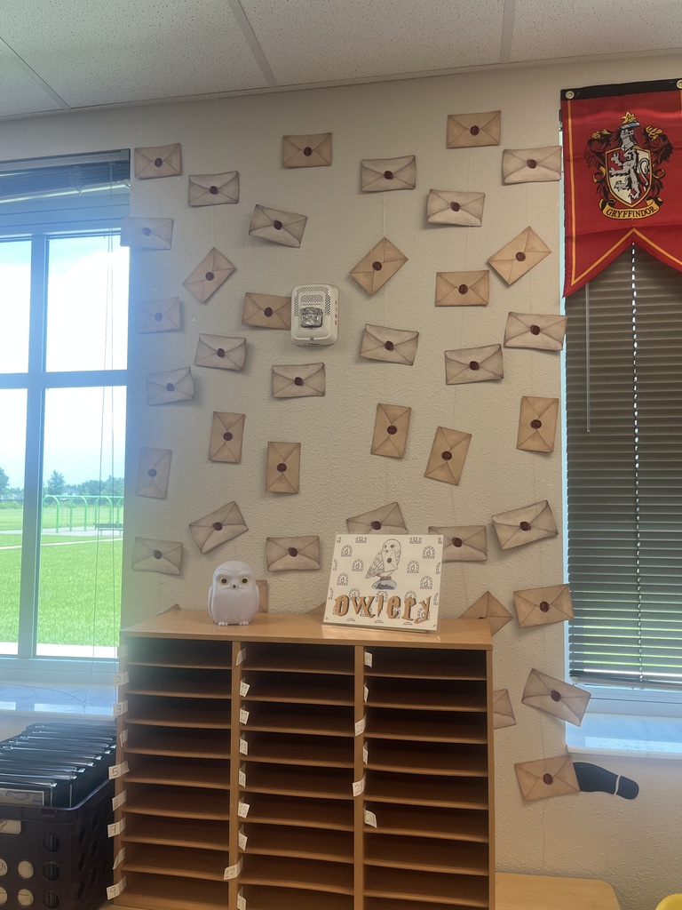 picture of a wall covered in envelopes