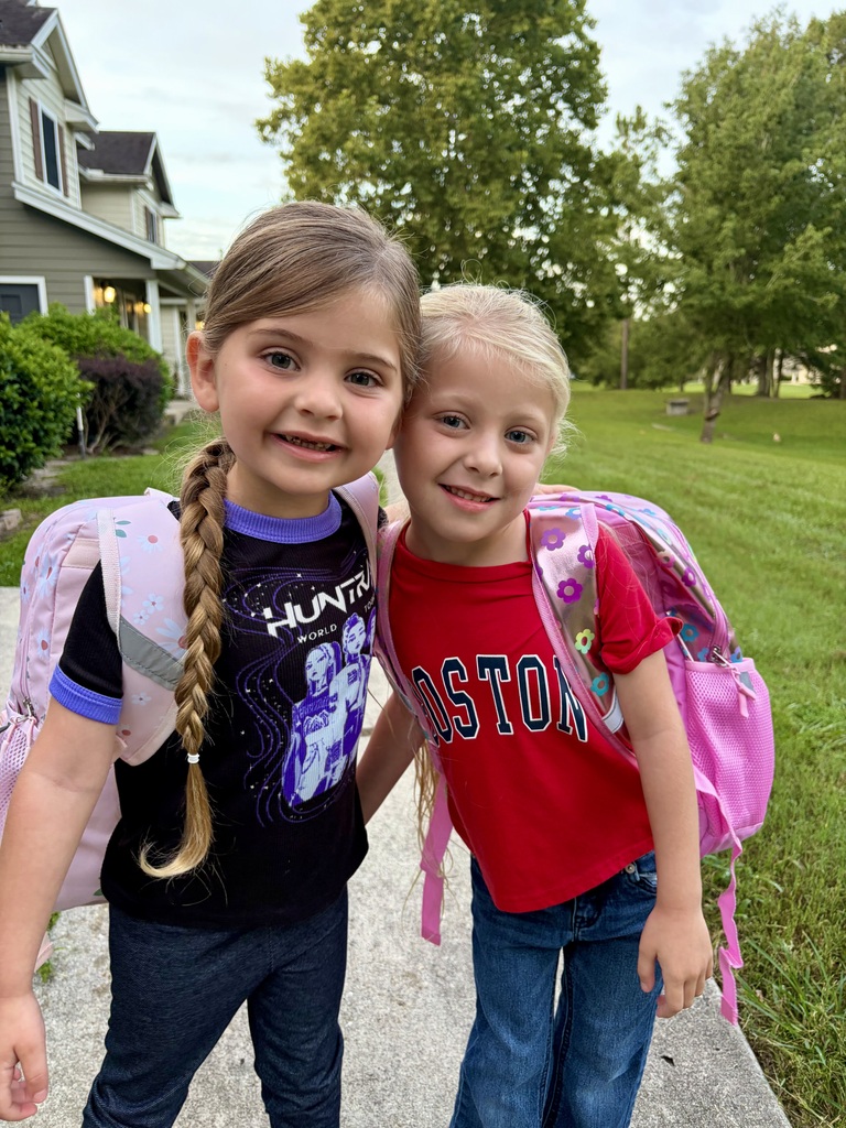 two girls smiling