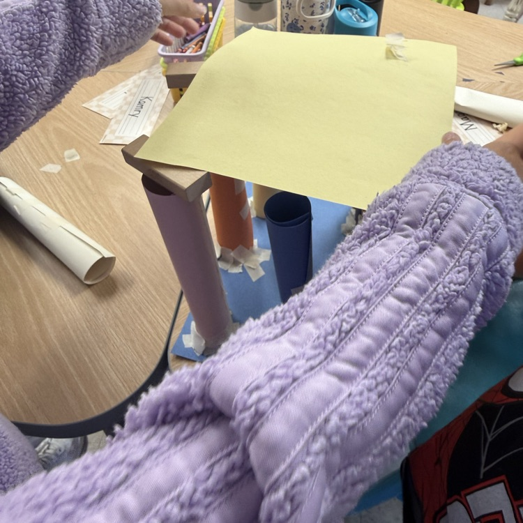 STEM Friday in 2nd grade. The objective was to make a structure that will hold blocks using paper, tape, & scissors that will hold wooden blocks and possibly other objects. They did great!