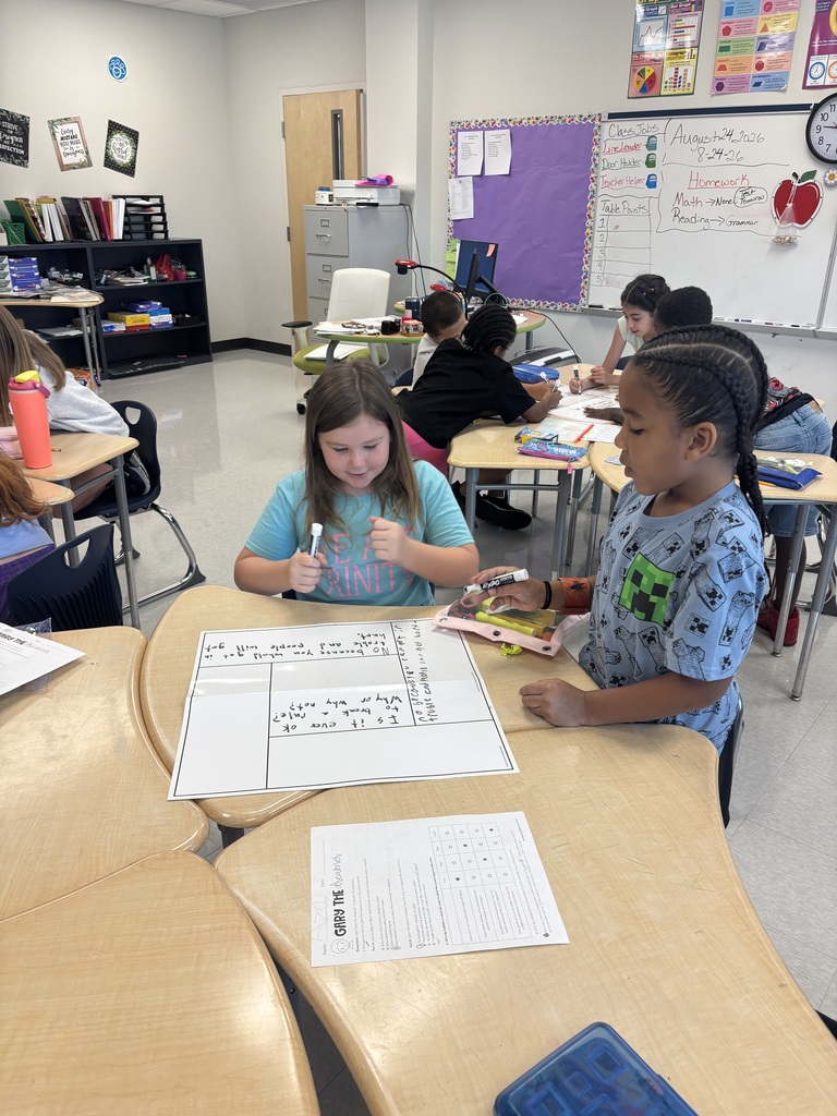 two students working at a desk