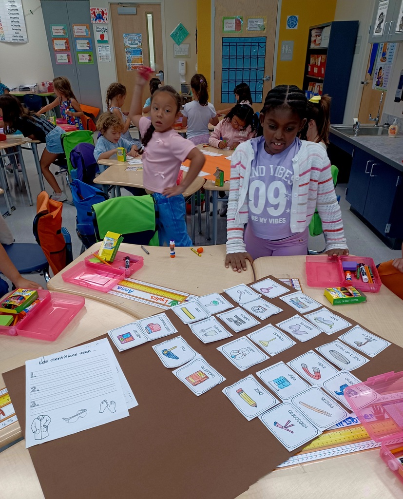 group of students working on a brown poster