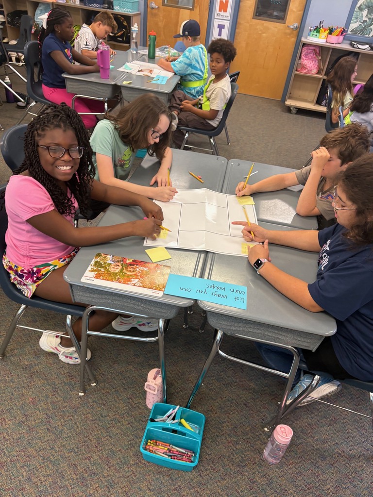 Students use critical thinking skills to work together in a 5th grade class