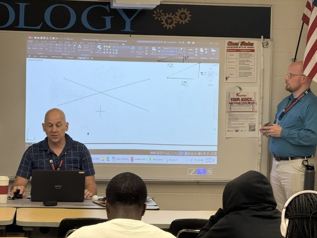 Mr. Murry and Mr. Powell brining Geometry and Engineering to life!