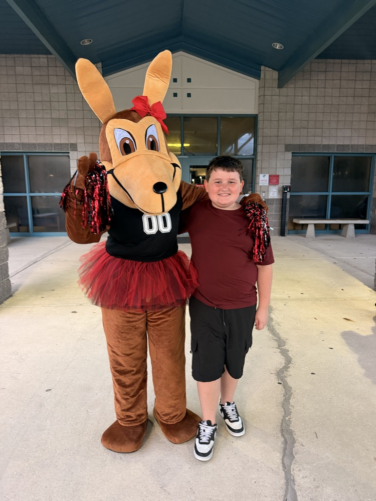coyote mascot with male Student