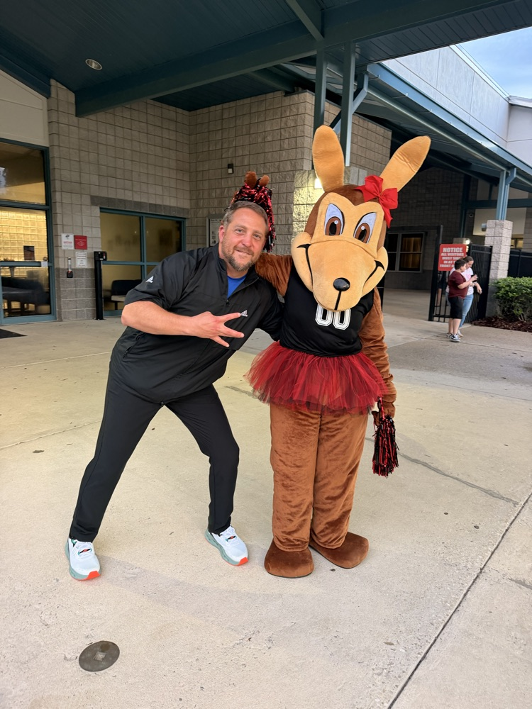 A dad being silly with the mascot