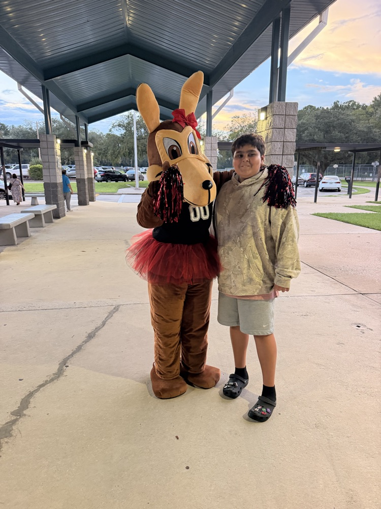 A male student with the mascot