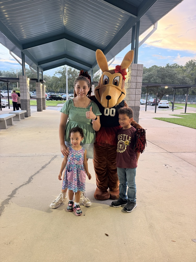 A family with the coyote mascot