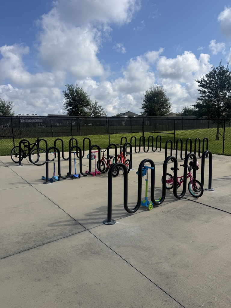 bike racks with scooters and bikes parked