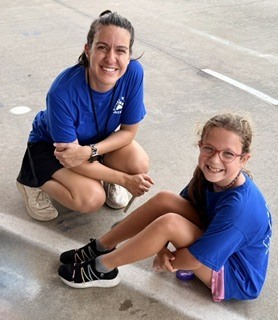 Teacher with a student at the Wiles Fun Run.