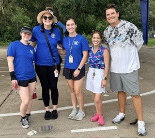 Specials teachers posing as a group at Wiles Fun Run.