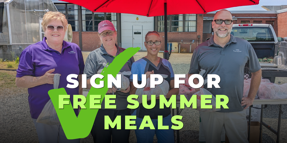 Horizontal photo of school nutrition staff holding bags of meals with overlaid text and green check mark that says SIGN UP FOR FREE SUMMER MEALS