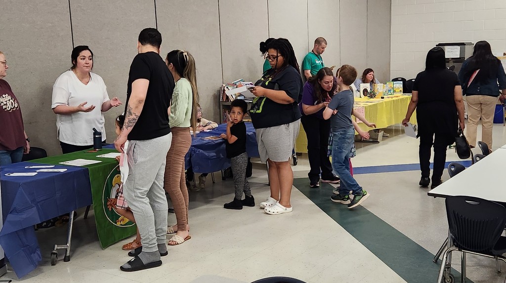 kindergarten open house families working at tables