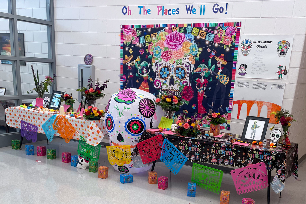 A vibrant Ofrenda display with a large skull centerpiece is displayed in the hallway at Southern Alamance High School