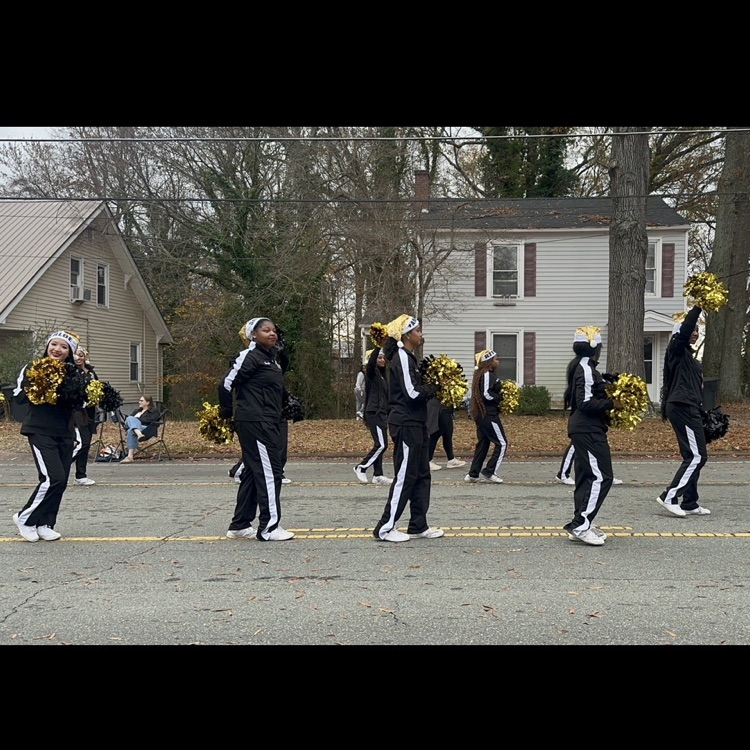 cheer leaders walking on pavement 