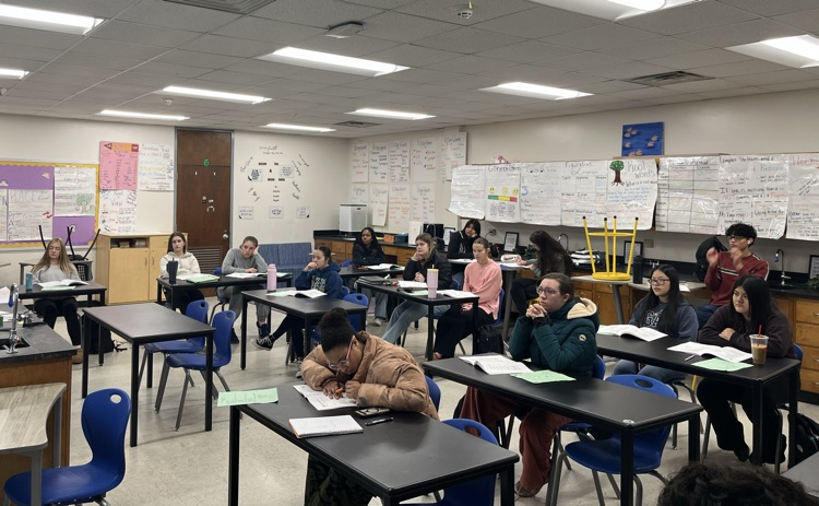 A teacher leads ACT prep lessons with a class of students