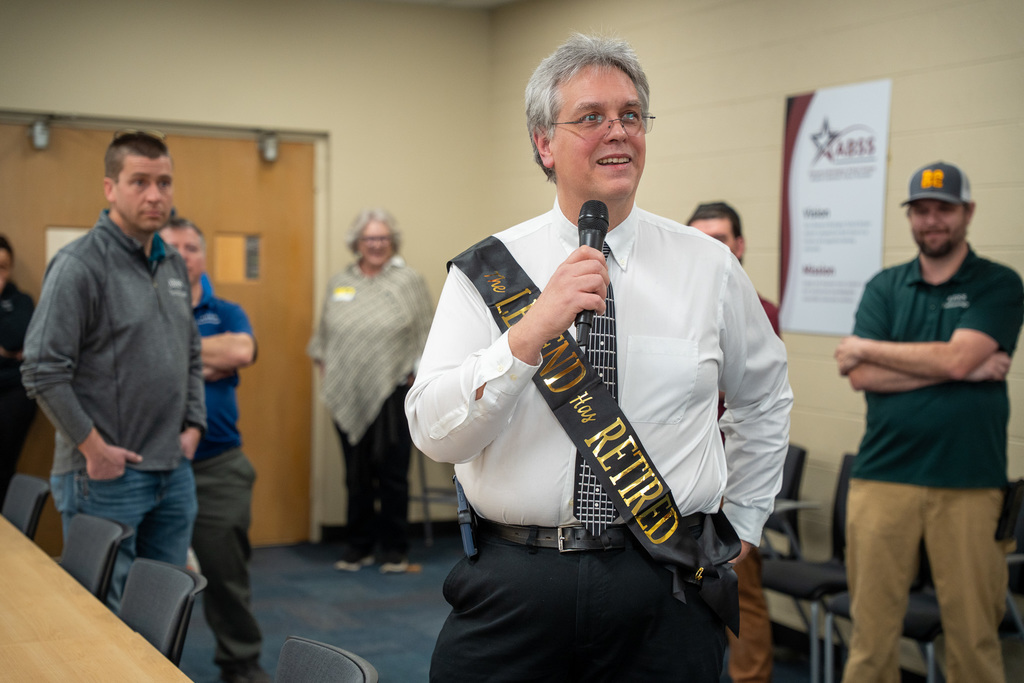 Dave speaking to attendees at his retirement party