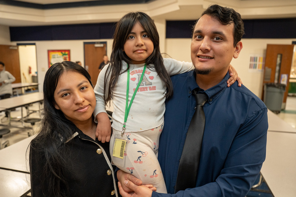 Parents with their student in the cafeteria