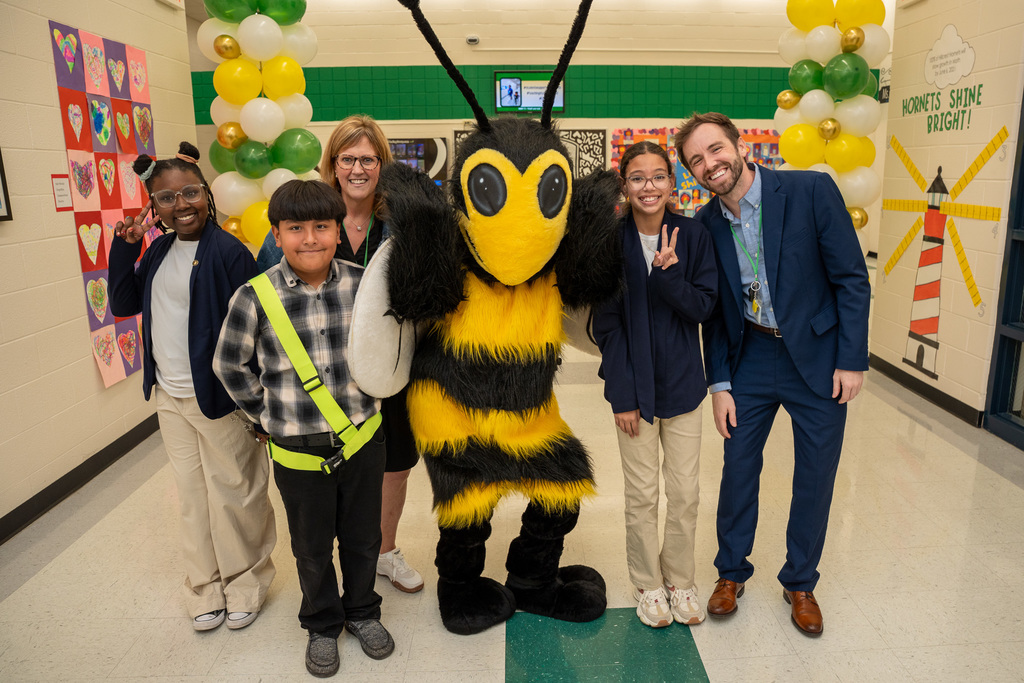 The Hillcrest staff and students pose with the hornet mascot