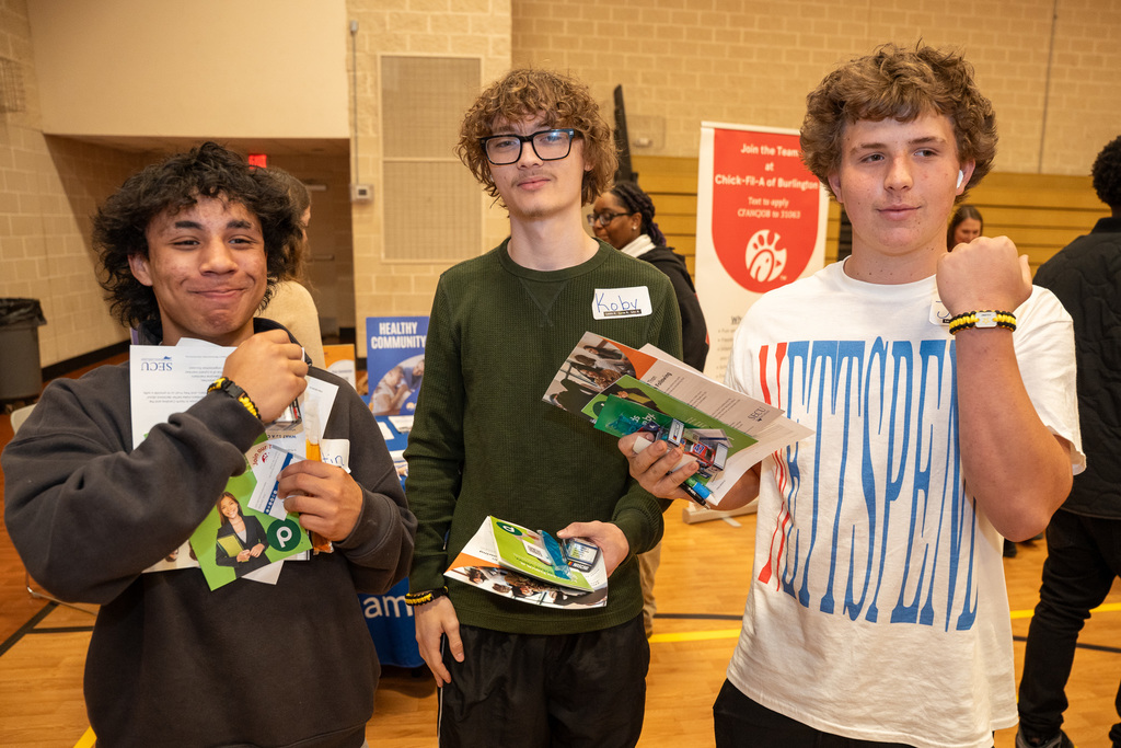 Three high school show off their job fair materials