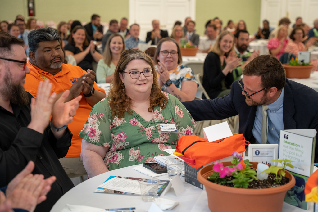 Ashley hearing the news she is the 2026 Teacher of the Year surrounded by colleagues and community members