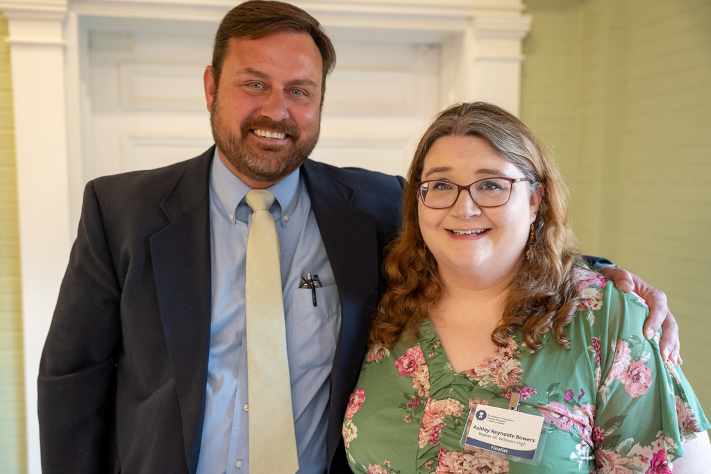 Ashley standing with Principal Curry Bryan