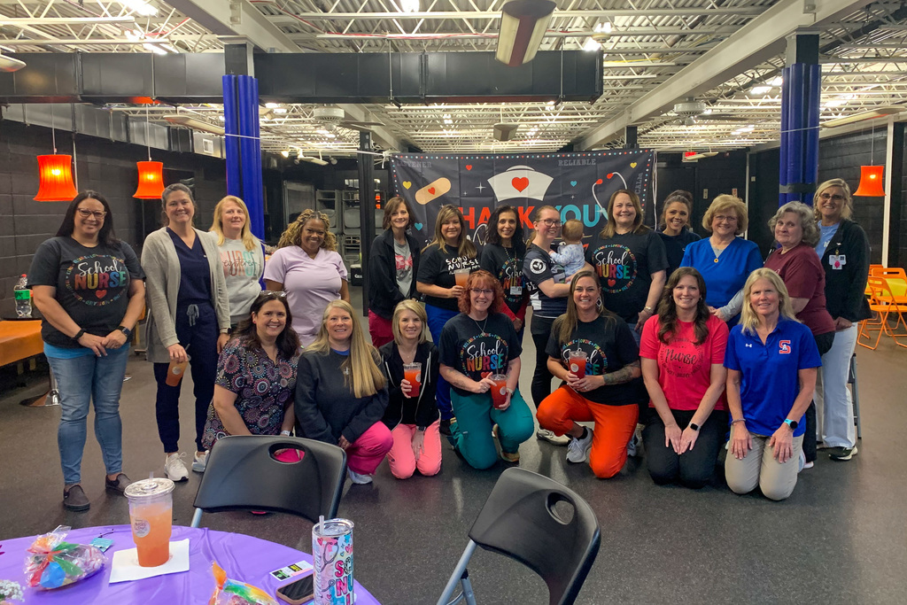 Group photo of school nurses gathered together during a thank you celebration at the Dream Center