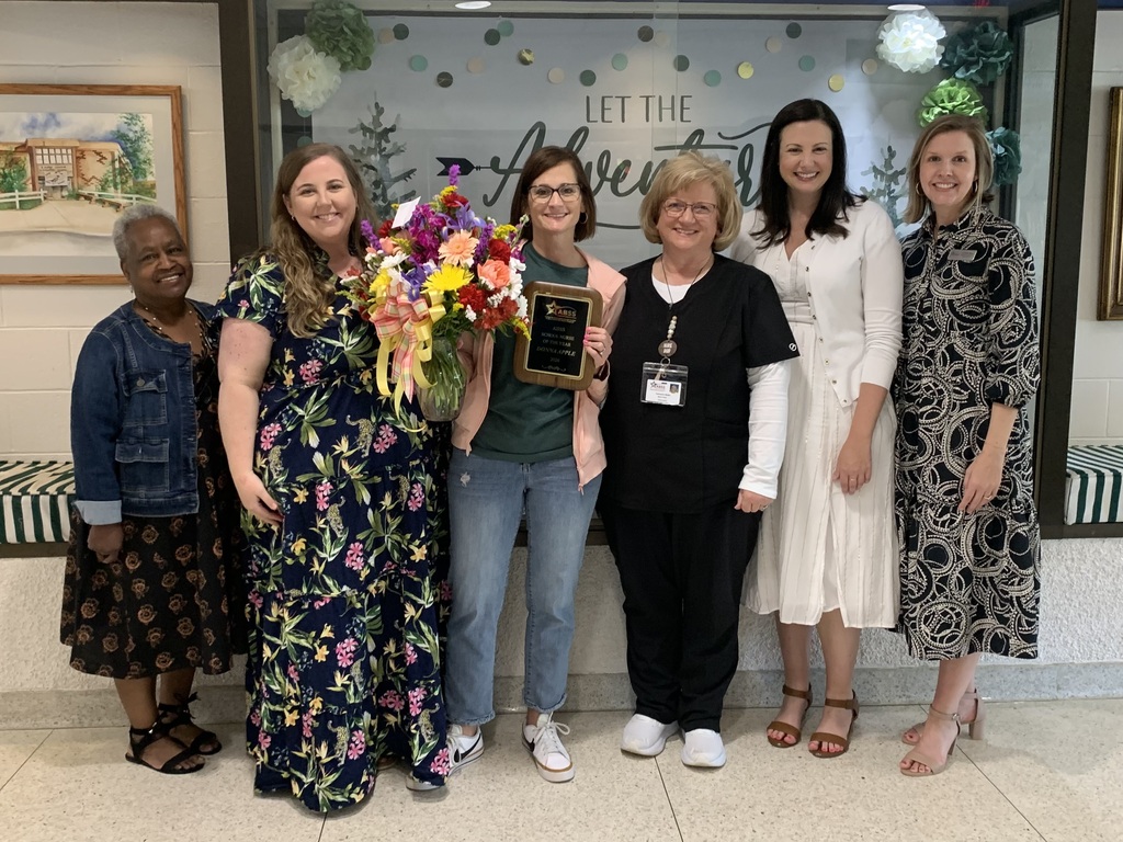 Nurse Babb stands next to district Student & Family Services personnel