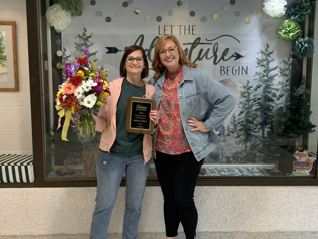 Nurse Babb stands with Principal Leslie Benson