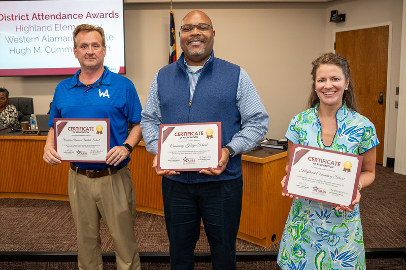 Three principals holding certificates of recognition