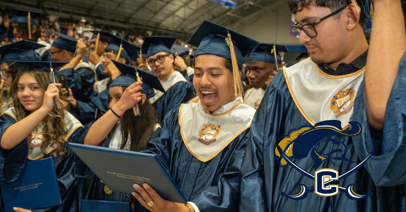 Hugh M. Cummings graduates celebrating after having turned their tassel at the end of the ceremony