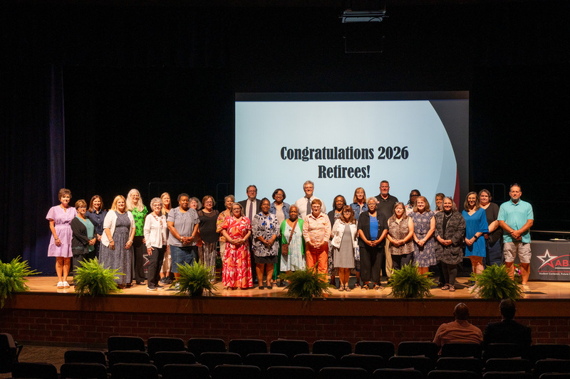 A group photo of all retirees recognized and present at the retirement celebration