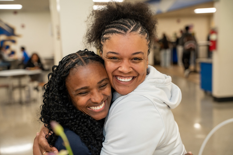 Jasmine hugs a staff member