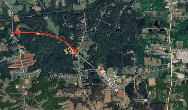 An aerial map of the region surrounding Southern High School with a red arrow showing a closed off portion of a road