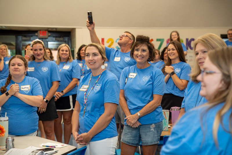 AO Elementary staff smile affectionately towards Principal Erin Millspaugh as she is recognized as the ABSS Principal of the Year
