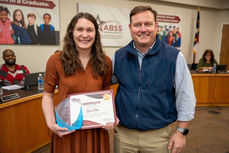 Lydia Allen standing with Principal Curry Bryan during recognitions
