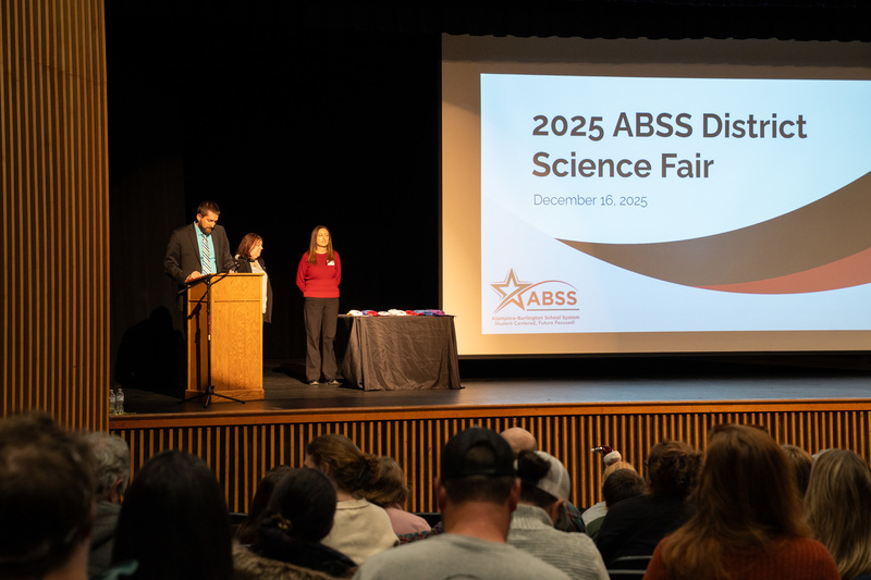 Presentation stage area for the ABSS District Science Fair awards at the Fine Arts Auditorium at Cummings High School