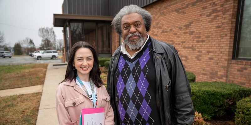 Mary Moorhouse and James Shields in front of Ray Street Academy