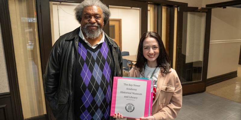 Mary Moorhouse and James Shields inside Ray Street Academy in front of the location for the museum