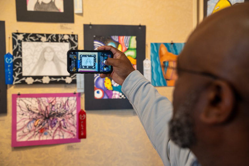 Woodlawn principal takes a photo of student artwork 