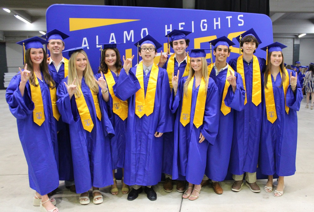 Top Ten Graduates pose before ceremony in caps and gowns