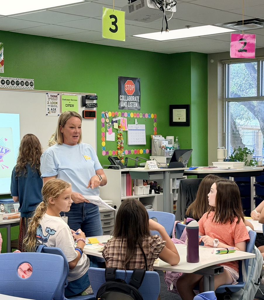 Teacher talking to students in classroom