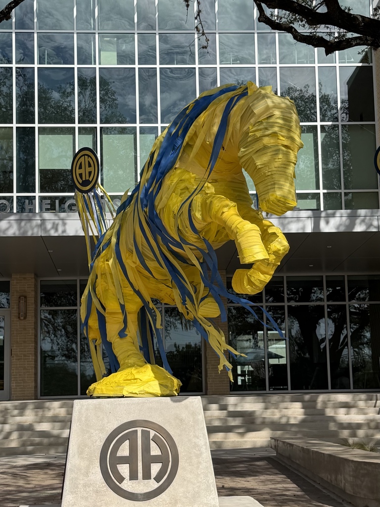 Mule statue wrapped in yellow and blue crepe paper 