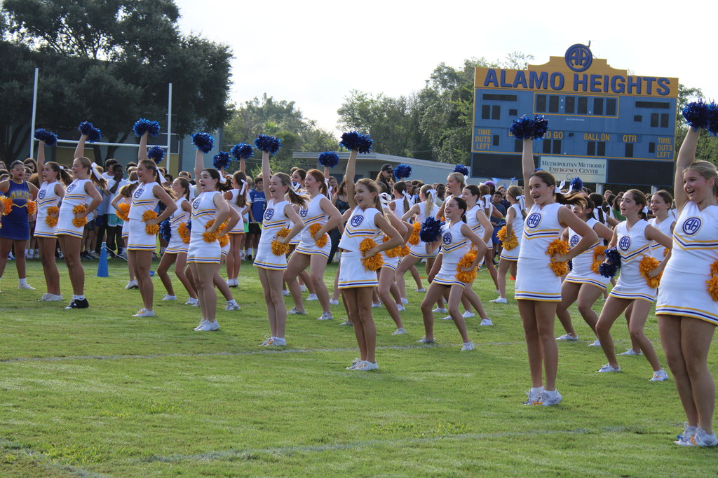 Cheer team performs on football field