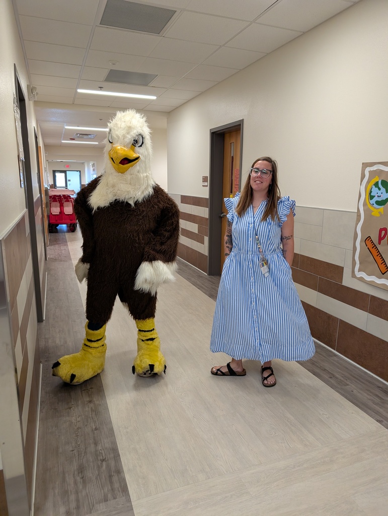Echo the Eagle being escorted by staff member